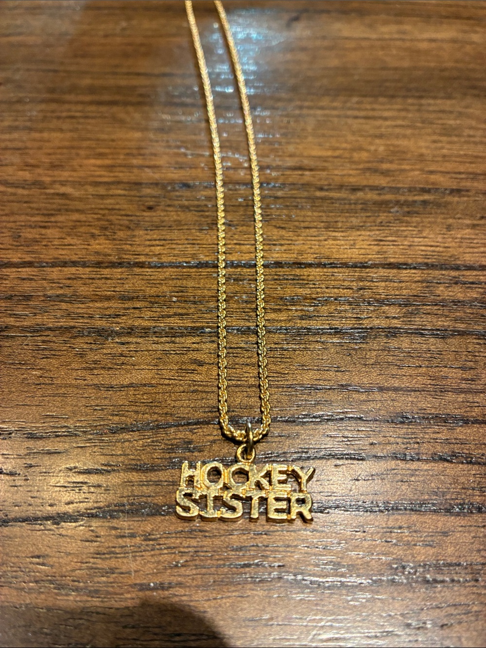 Gold-Tone "Hockey Sister" Pendant Necklace